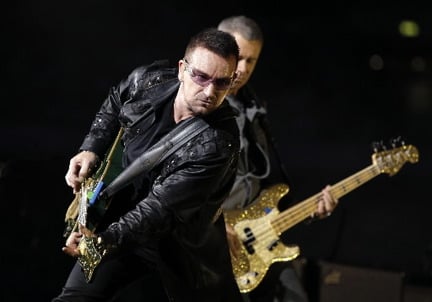 U2 will headline the second of two Rock and Roll Hall of Fame 25th anniversary concerts booked for Thursday and Friday, Oct. 29-30, at Madison Square Garden in New York. Shown here onstage in London in August are Bono, left, and bass player Adam Clayton. © Joel Ryan, Associated Press