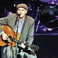 James Taylor performs in concert. 