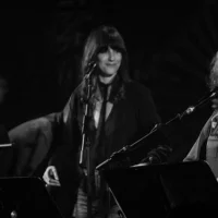 Bonnie Raitt, right, is joined by singer Nicki Bluhm and guitarist Danny Grenier at Saturday's Americana Music Assn. all-star salute to Eagles founding member Glenn Frey, at the Troubadour in West Hollywood. © Austin Nelson