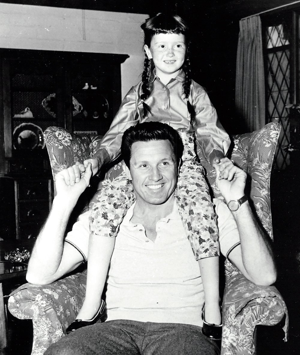 Bonnie Raitt with her father, John, in 1957, while he filmed The Pajama Game in California. © Warner Bros.