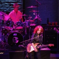 Bonnie Raitt (center) is accompanied on tour by Ricky Fataar (left) on drums and James "Hutch" Hutchinson on the electric bass guitar as she performs at the Verizon Theater in Grand Prairie on Saturday night, September 29, 2012.  © Stewart F. House /Special Contributor