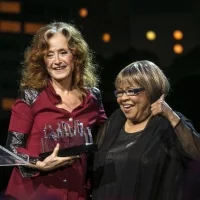 Bonnie Raitt receives her award from Mavis Staples during the Austin City Limits Hall of Fame Induction and Celebration held at ACL Live at the Moody Theatre, in Austin, Tx., on Wednesday, Oct. 12, 2016. Performers B.B. King, Bonnie Raitt and Kris Kristofferson, were inducted. (AUSTIN AMERICAN-STATESMAN / RODOLFO GONZALEZ)