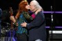David Crosby of Crosby, Stills and Nash with Bonnie Raitt onstage at the 25th Anniversary Rock & Roll Hall of Fame Concert at Madison Square Garden on October 29, 2009 in New York City.