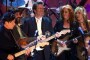 Robbie Robertson, Zal Yanovsky of The Lovin' Spoonful, Eric Clapton, Bonnie Raitt and Melissa Etheridge perform together during the jam session following the 15th Annual Rock and Roll Hall of Fame Induction Dinner early Tuesday, March 7, 2000, at New York's Waldorf-Astoria.